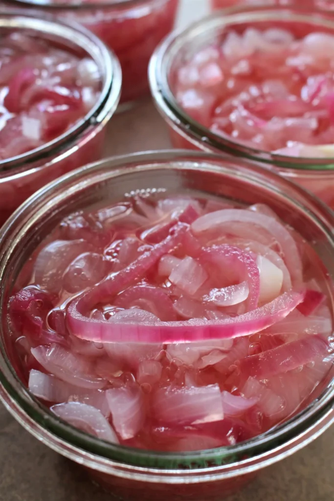 A jar of pickled red onions for delicious toppings and recipes.