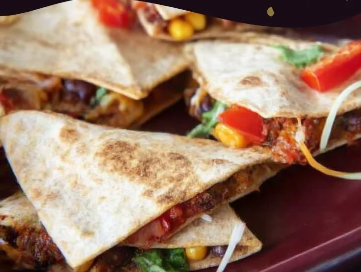 A variety of healthy lunch ideas displayed on a wooden table.