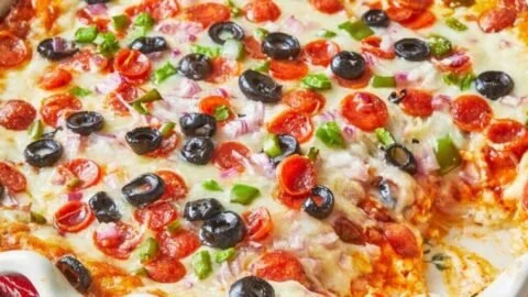 Delicious Pioneer Woman Pizza Dip served in a dish with toppings