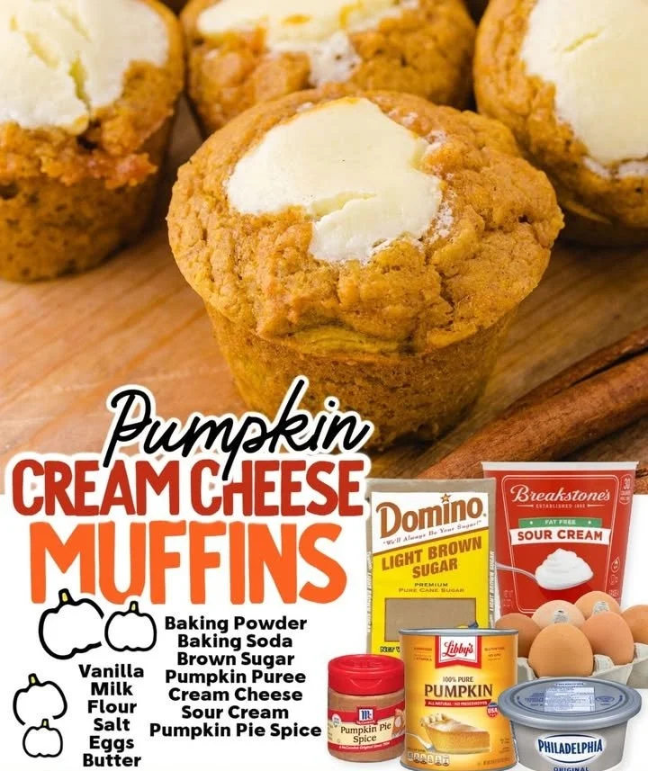 Freshly baked Pumpkin Cream Cheese Muffins on a rustic wooden table.