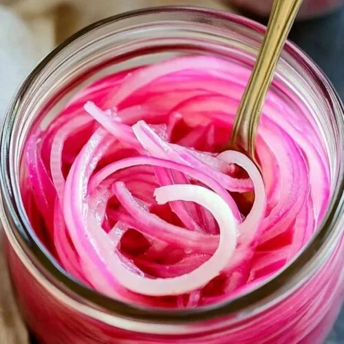 Jar of quick pickled red onions ready to enhance meals