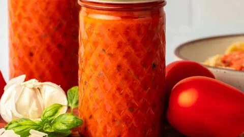 Roasted tomato pasta sauce served over spaghetti with fresh basil