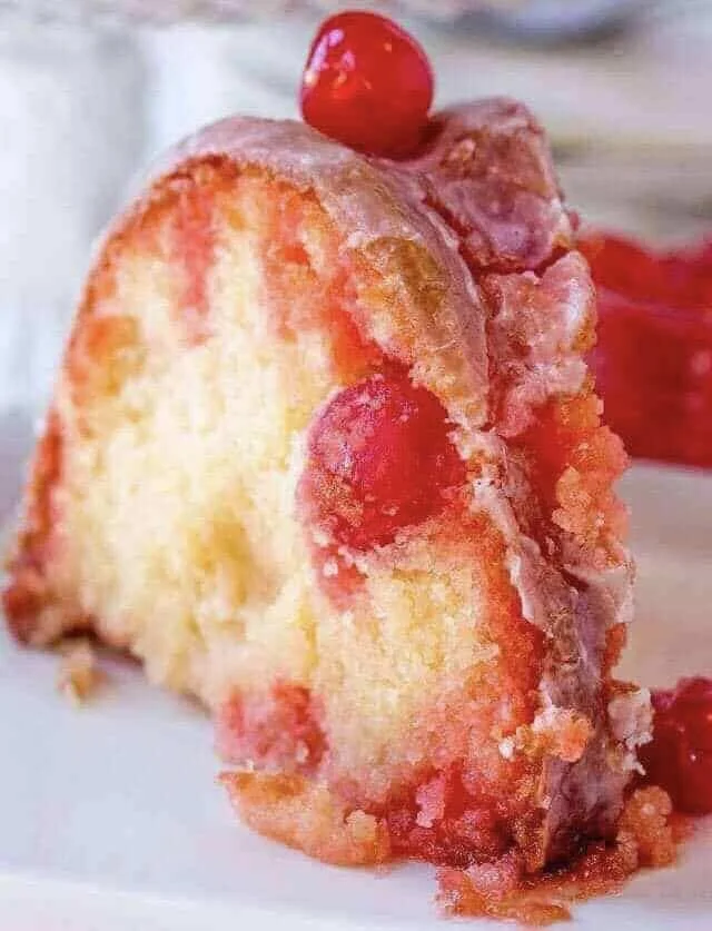 Delicious homemade Shirley Temple Cake with cherry and citrus flavors.
