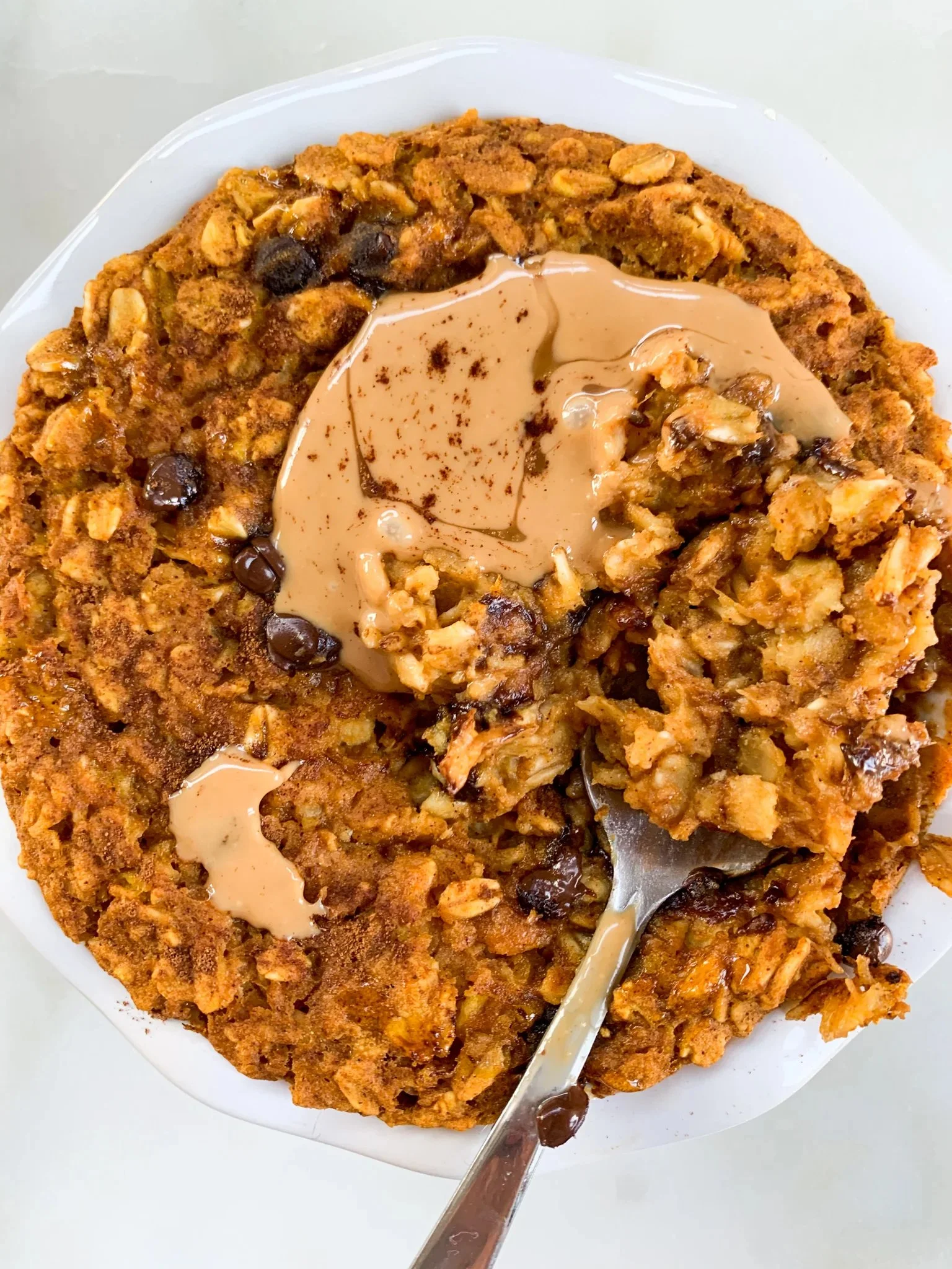 Single Serve Chocolate Chip Pumpkin Oatmeal in a bowl with chocolate chips
