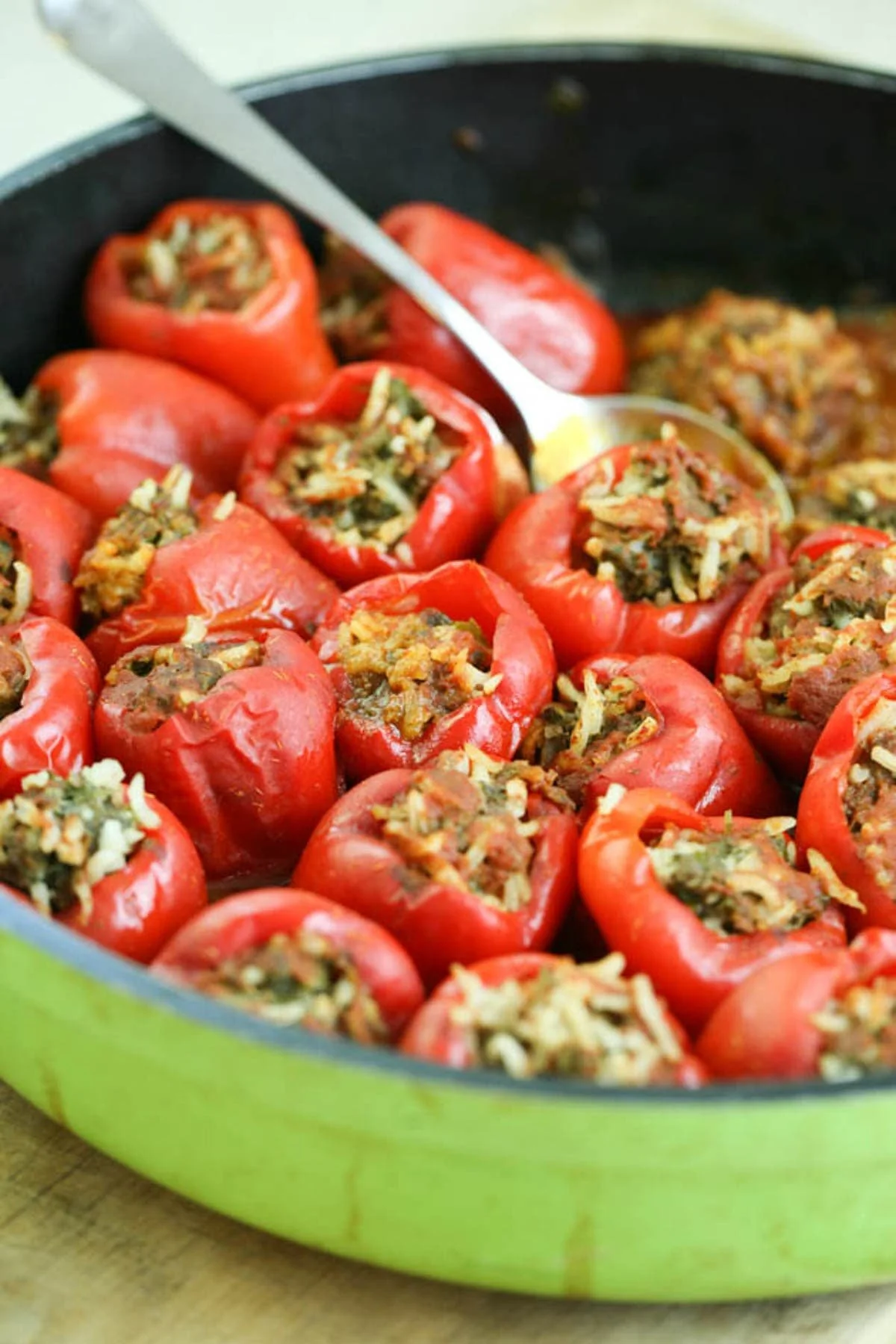 Colorful stuffed peppers filled with rice, beans, and vegetables on a plate