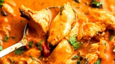 Delicious Thai Red Curry Chicken served with rice and vegetables