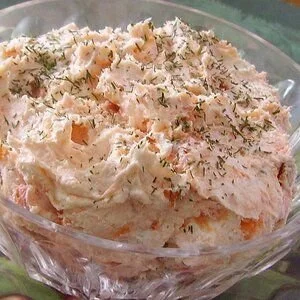 Creamy smoked salmon dip served in a bowl with crackers