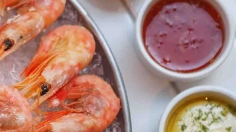 Assorted dipping sauces for shrimp on a plate, highlighting flavor variety.