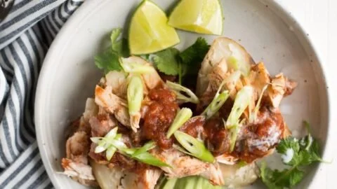 Whole30 Slow Cooker Salsa Chicken Stuffed Potatoes served on a plate