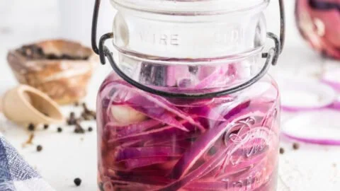 Jar of zesty pickled onions ready to enhance meals with flavor