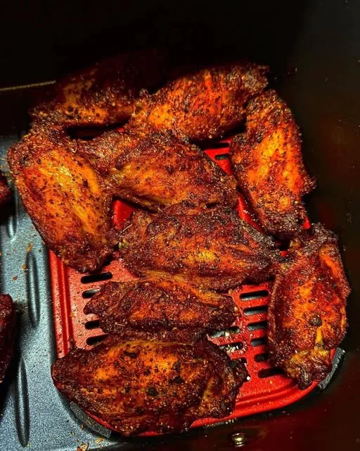 Crispy air fryer wings served with dipping sauce.