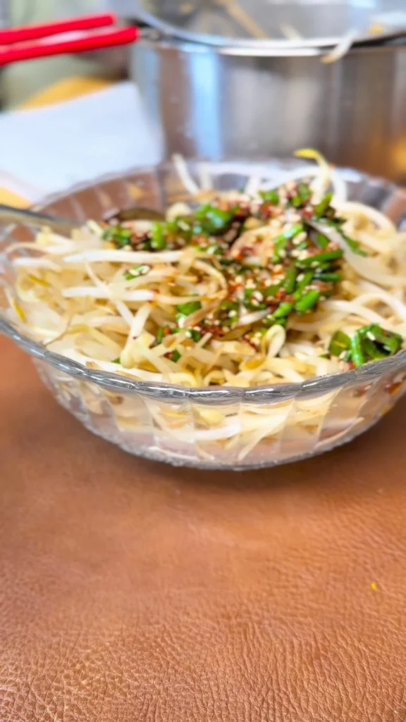 A colorful Beans Sprouts Salad with fresh ingredients served in a bowl.