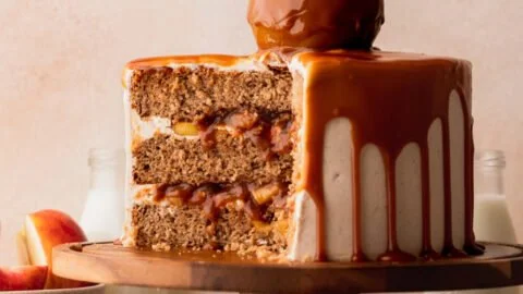 Delicious caramel apple cake topped with caramel drizzle and apple slices