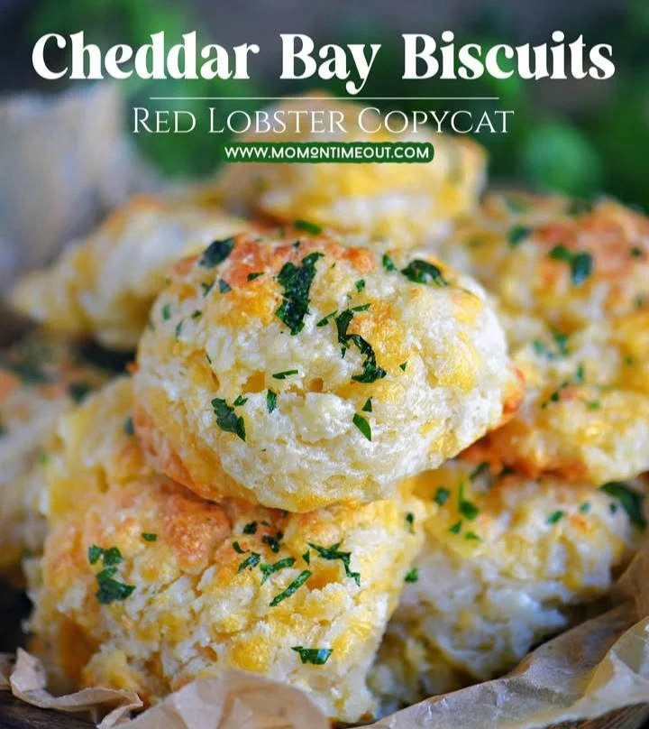 Golden Cheddar Bay Biscuits fresh from the oven, topped with garlic and herbs.