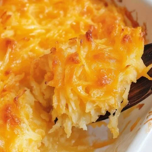Delicious Cheesy Hashbrown Casserole ready to serve.