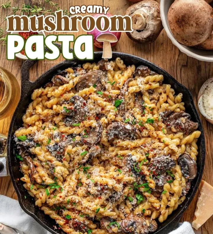 Delicious creamy mushroom pasta served in a bowl with fresh herbs
