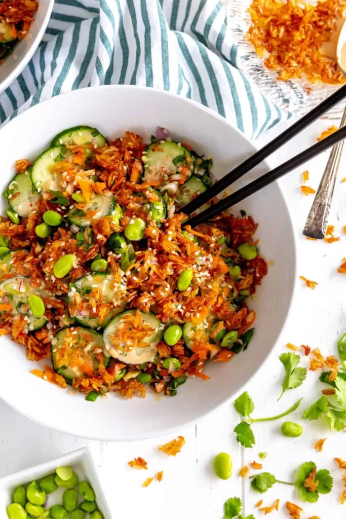Cucumber Rice Salad with crispy rice and chili-garlic dressing served in a bowl