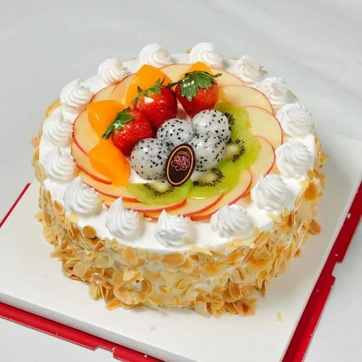 Delicious Fresh Fruit Cake topped with colorful seasonal fruits