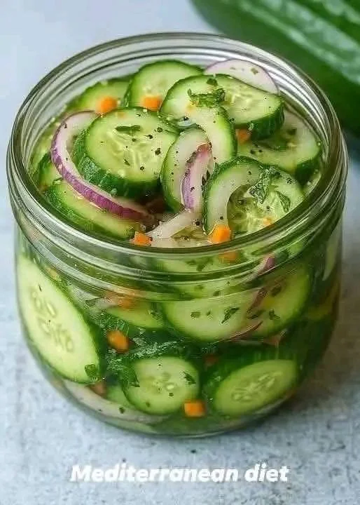 Fresh pickled cucumber salad with vibrant cucumbers and herbs