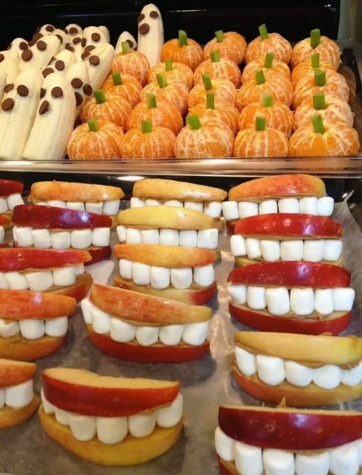 Assorted fruity Halloween snacks arranged on a festive platter