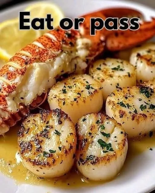 Delicious Garlic Butter Lobster and Scallops served on a plate