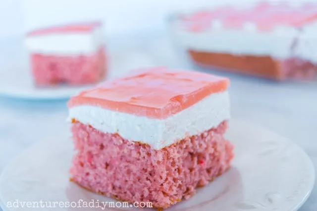 Slice of guava cake showcasing its moist texture and vibrant color.