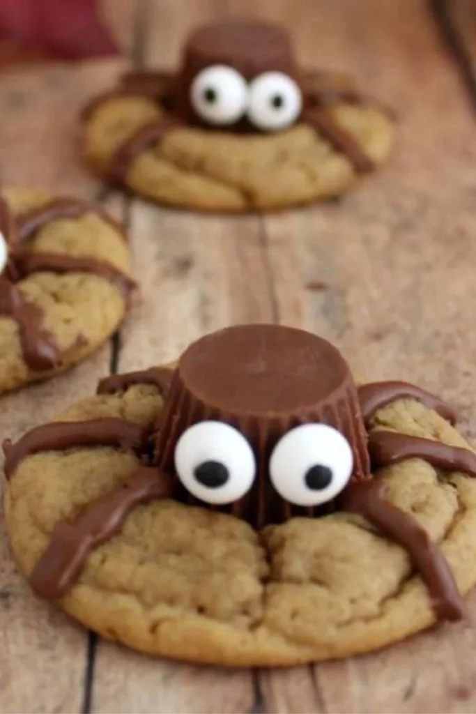 Delicious Halloween spider cookies decorated with icing and candy