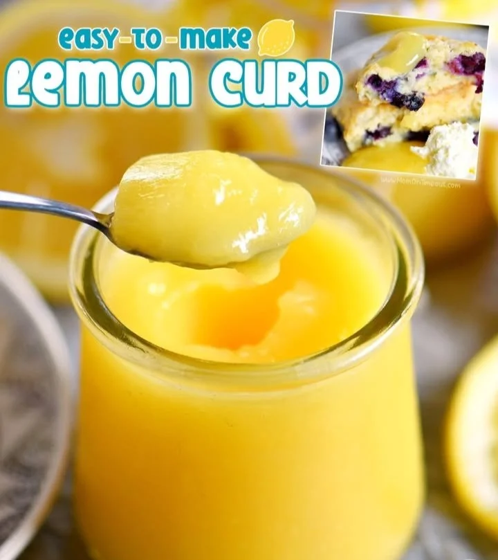 Homemade lemon curd in a jar with fresh lemons and a spoon