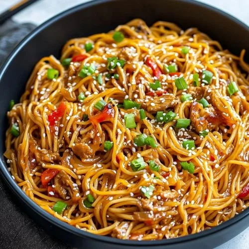 One pan teriyaki chicken and noodles served in a bowl with fresh vegetables