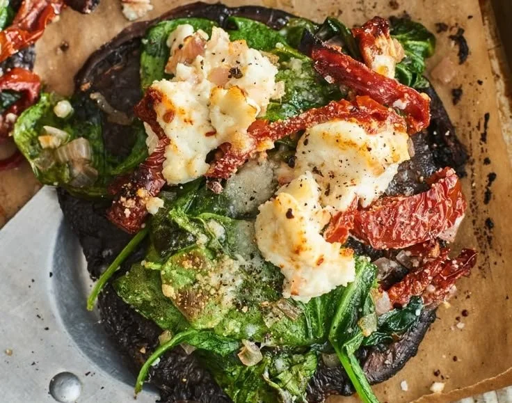 Delicious stuffed portobello mushrooms topped with herbs and cheese.
