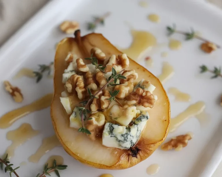 Baked pears with berries, honey, walnuts, and blue cheese for a delicious dessert