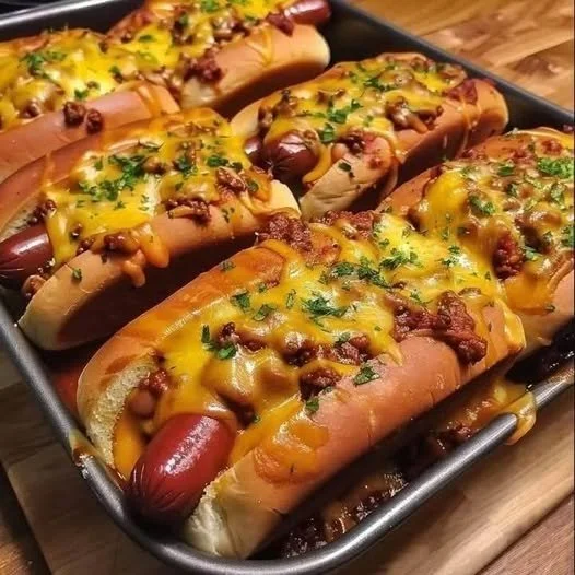 Chili Cheese Dog Bake with melty cheese and hearty chili over hot dogs
