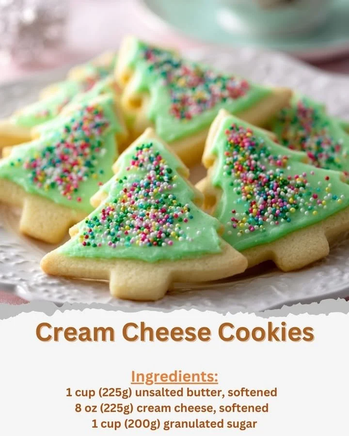 Plate of freshly baked cream cheese cookies on a wooden table