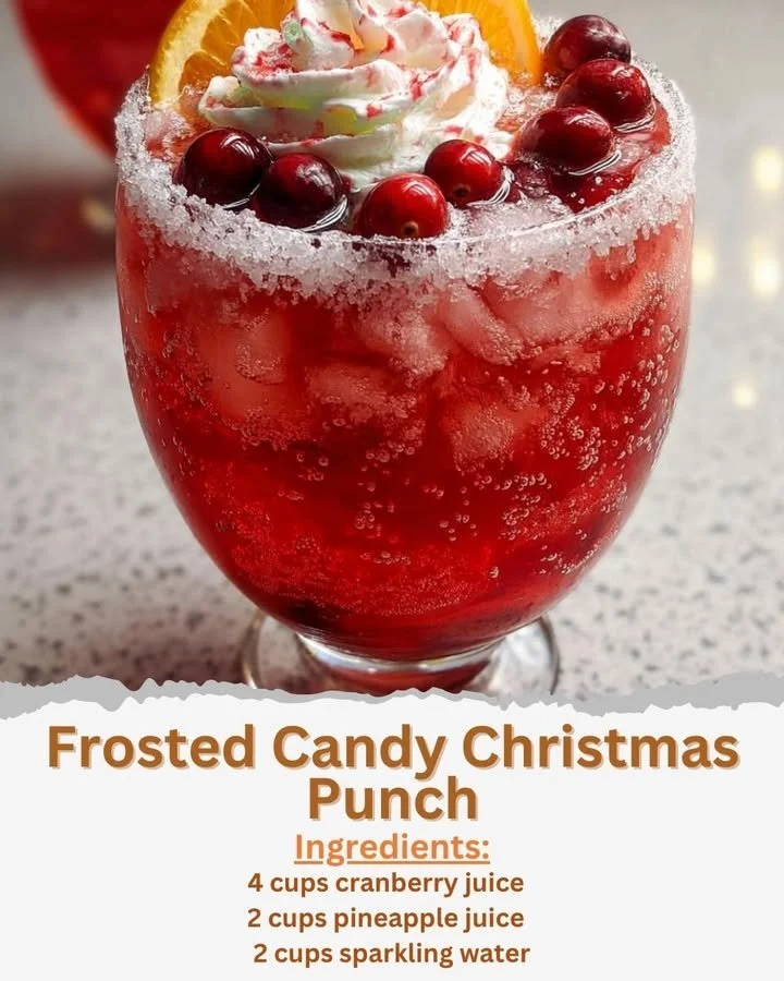 Frosted Candy Christmas Punch served in a festive glass with candy decorations