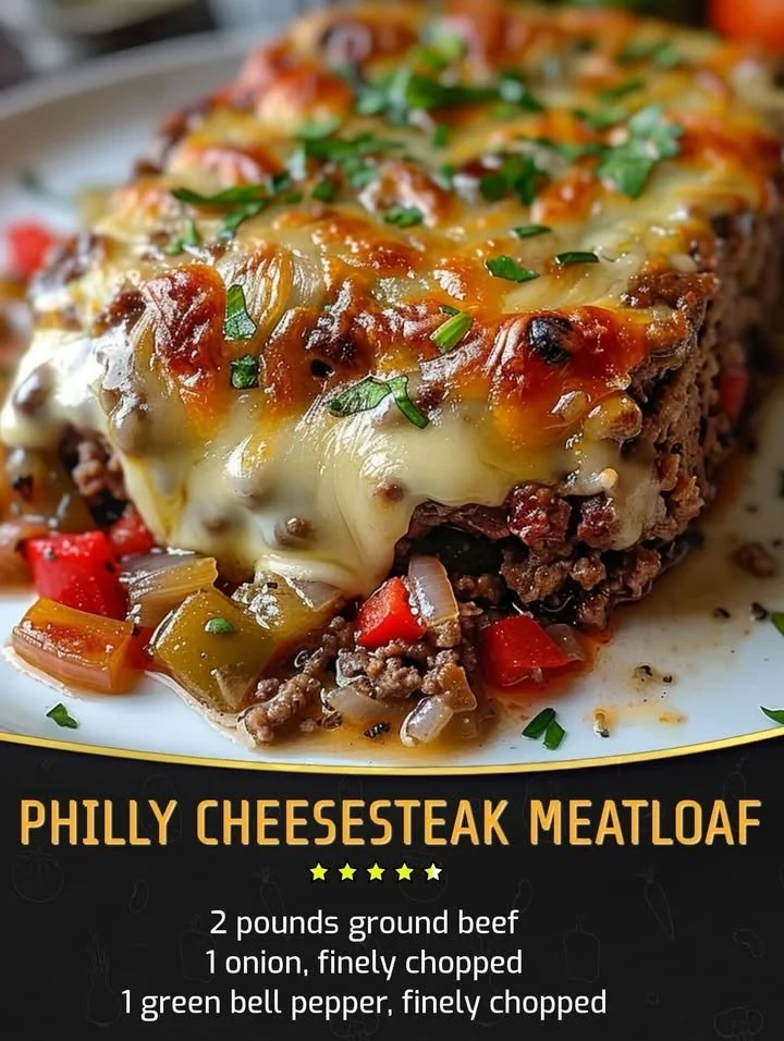 Philly Cheesesteak Meatloaf topped with melted cheese and peppers
