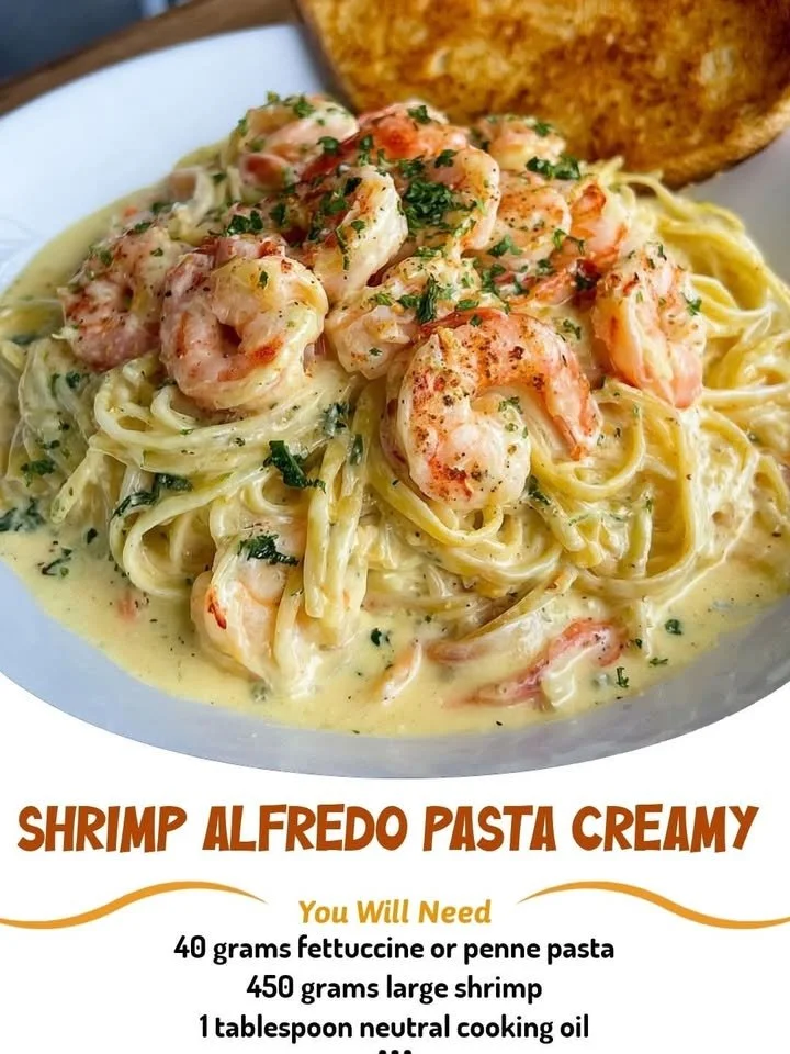 Plate of creamy Shrimp Alfredo Pasta garnished with parsley