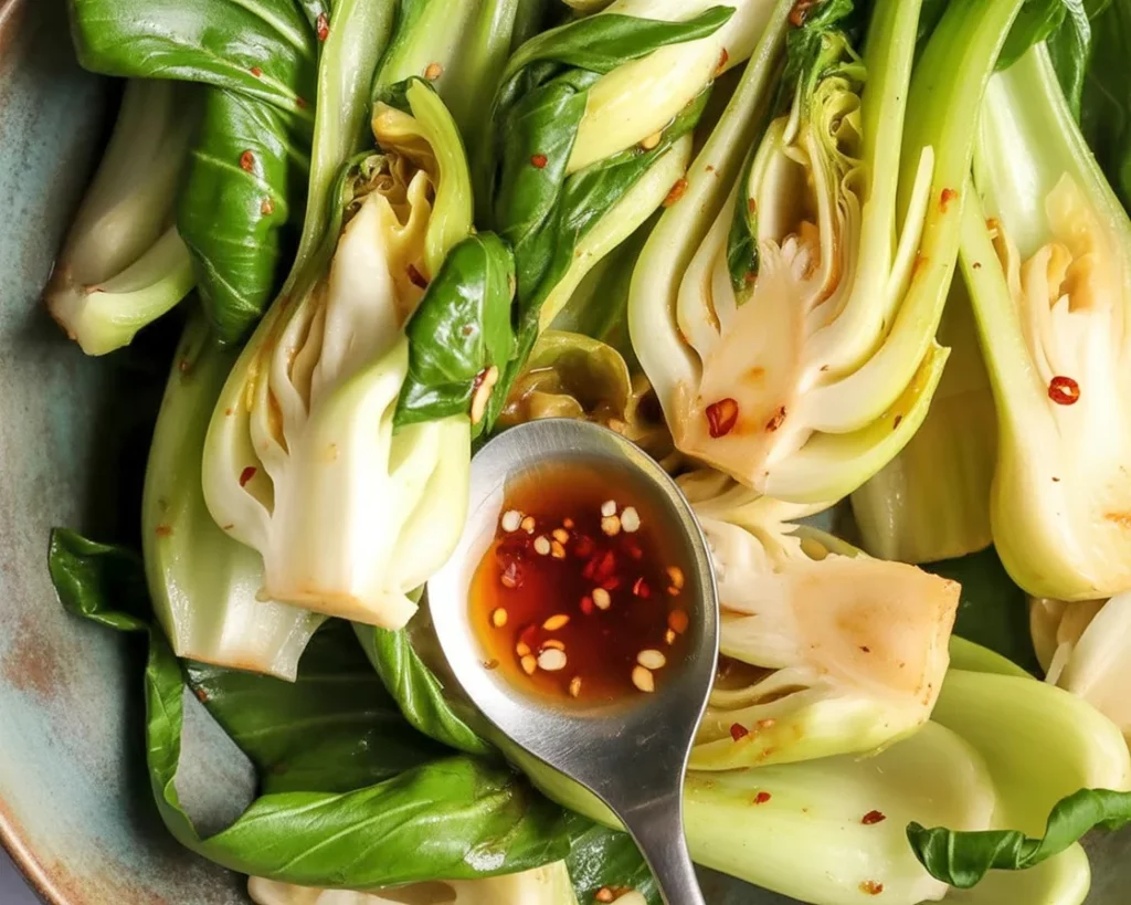 Stir-fried baby bok choy with soy garlic glaze in a vibrant bowl