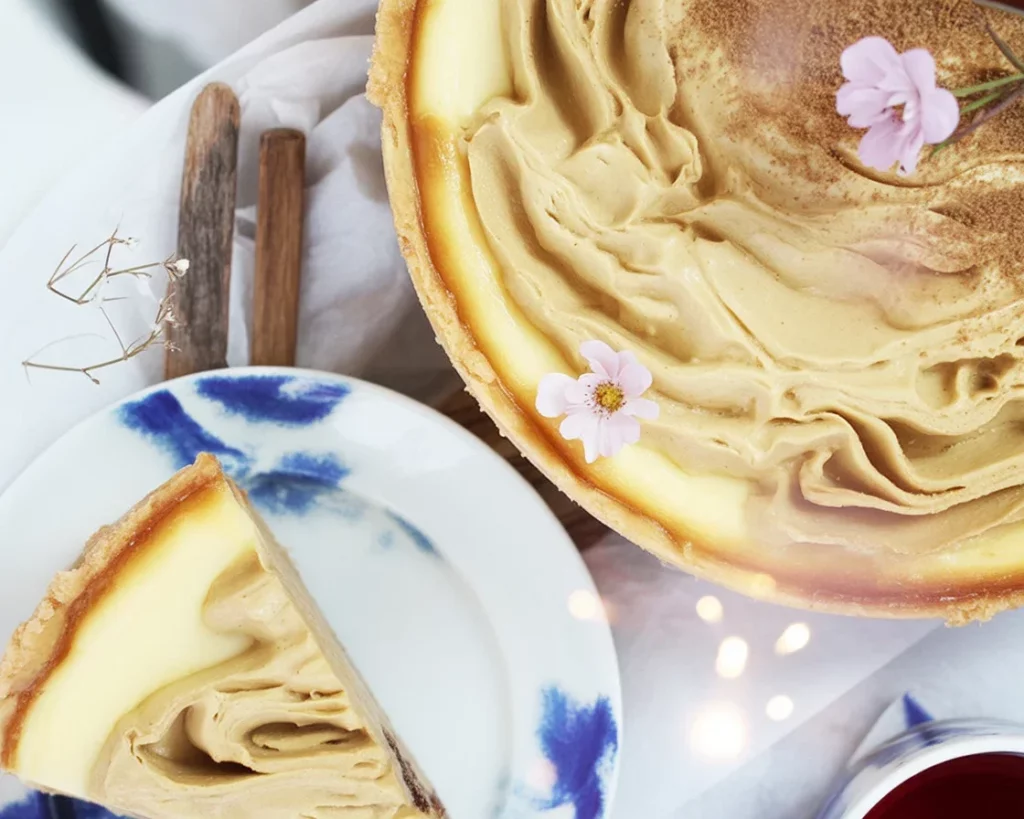 Delicious Sweet Potato Cheesecake Pie with a gingersnap crust, perfect for holidays.