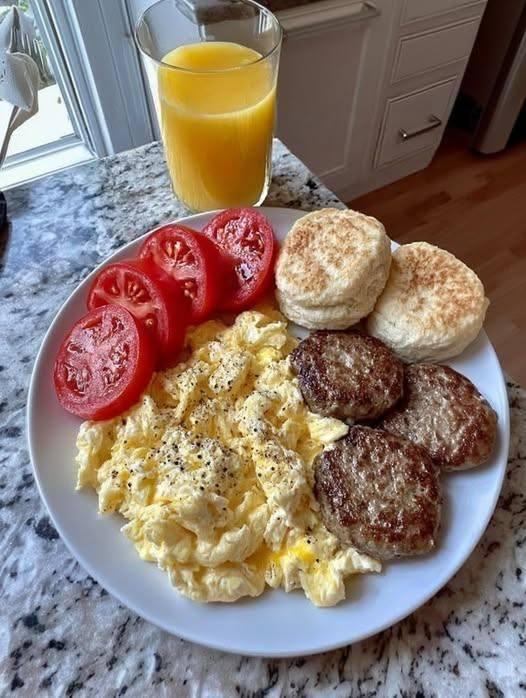 Breakfast Feast with Scrambled Eggs, Sausage Patties, Biscuits, and Tomatoes!