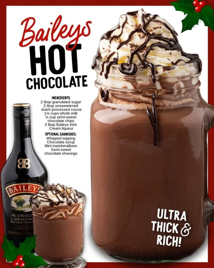 Delicious Bailey's hot chocolate topped with whipped cream and cocoa powder