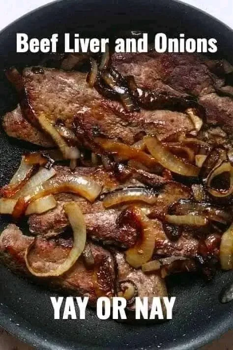 Plate of sautéed beef liver and onions with herbs