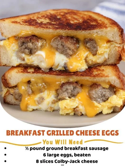 Breakfast grilled cheese with eggs, melted cheese, and golden bread on a plate.