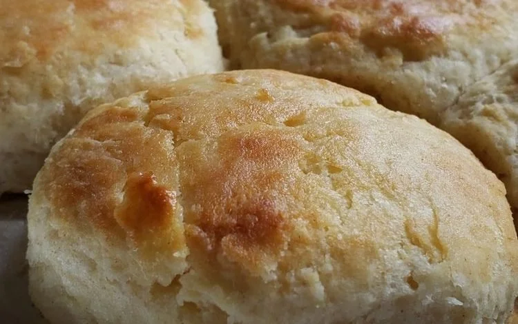 Freshly baked buttermilk biscuits with honey butter glaze on top