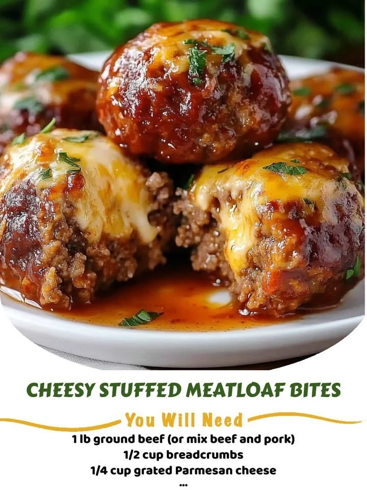 Cheesy stuffed meatloaf bites served on a plate with garnish.