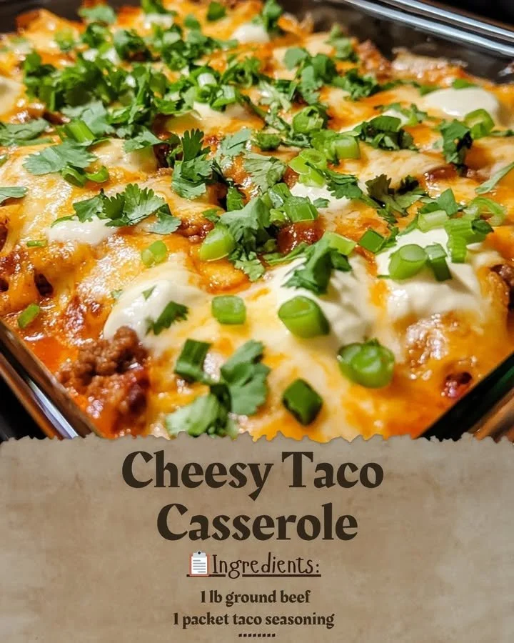 A delicious Cheesy Taco Casserole topped with melted cheese and garnished with fresh herbs.