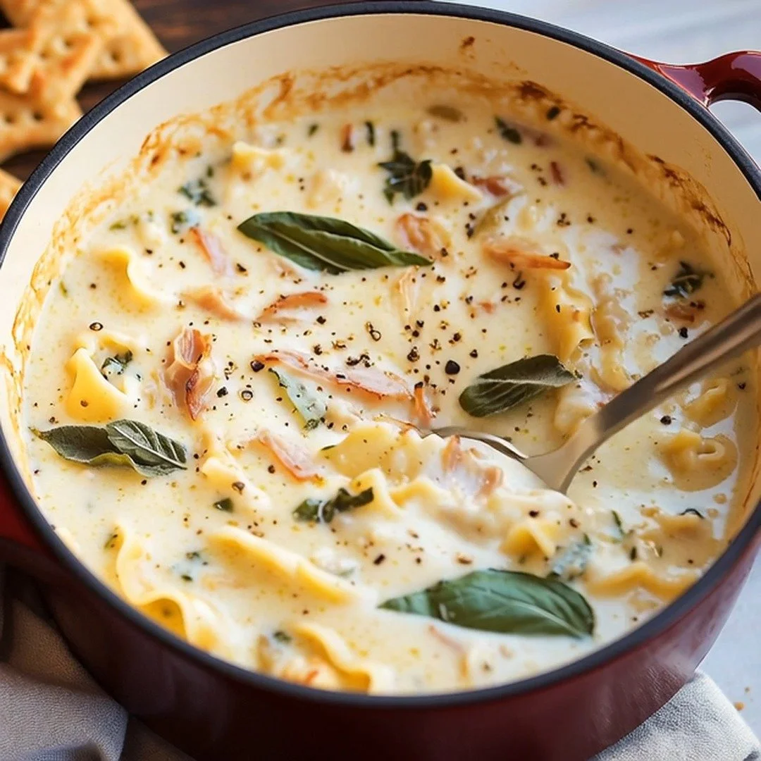 Creamy white lasagna soup garnished with herbs in a bowl