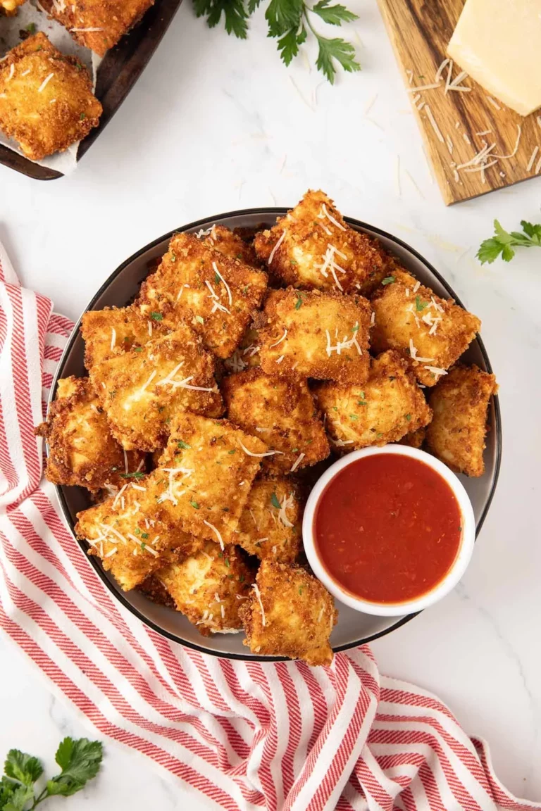 Plate of crispy Fried Cheese Ravioli served with marinara sauce