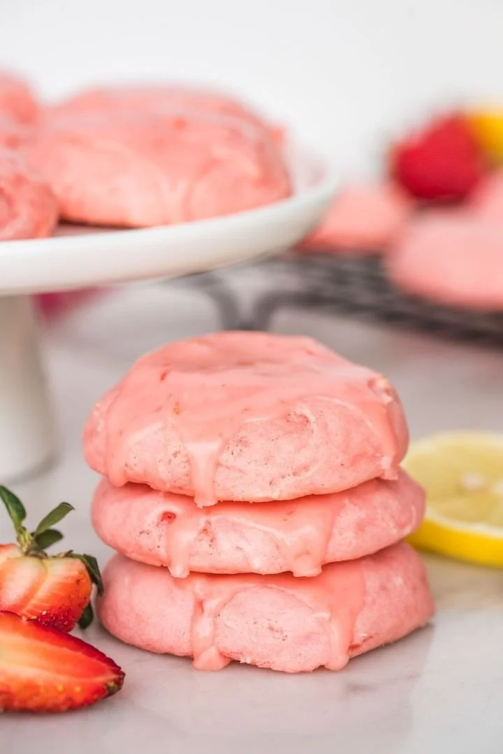 Glazed strawberry cake mix cookies on a plate, showcasing their delicious texture and glaze