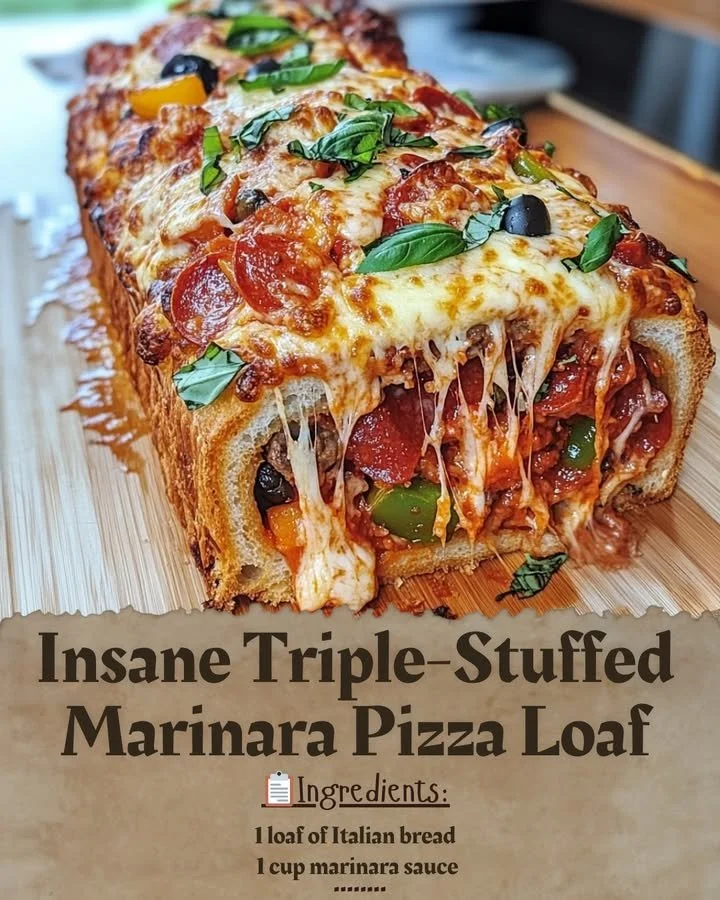 Insane Triple-Stuffed Marinara Pizza Loaf topped with cheese and marinara sauce