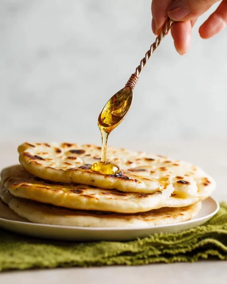 Delicious Moroccan Msemmen flatbread served with honey and butter